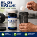 BCAA Shock fruit punch powder being added to a shaker for workout recovery, strength and endurance support